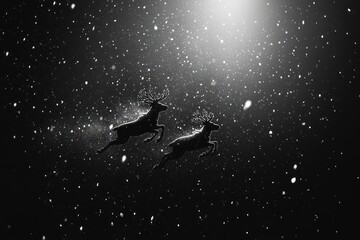 Fototapeta premium Two reindeer leap through a snowy night sky, illuminated by a bright light.