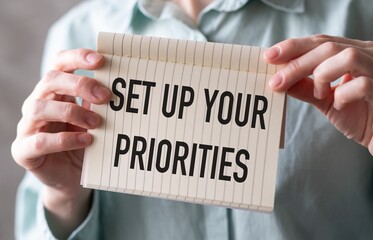Businesswoman with notebook Set Up Your Priorities Reminder for daily tasks plans To do list concept
