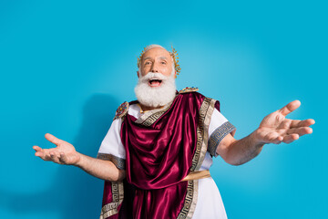 Photo of handsome senior male laughing have fun wear ancient greek god king dress isolated on blue color background