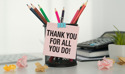 written THANK YOU FOR ALL YOU DO! - concept of bonus year end or holiday gift money for team staff...