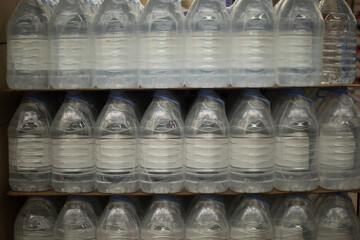 Water bottles. Water in store. Bottles in plastic packaging.