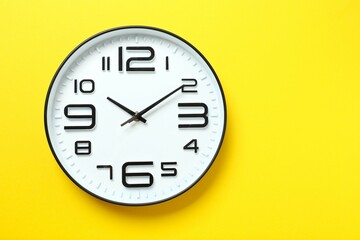 Big beautiful stylish clock on color background