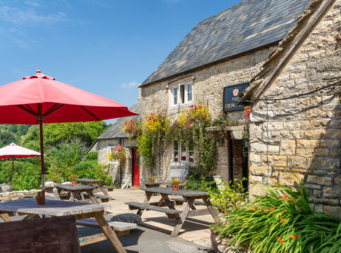 The Crown Inn a 17th Century traditional British country village pub at Frampton Mansell in The Cotswolds on August 6 2018, United Kingdom