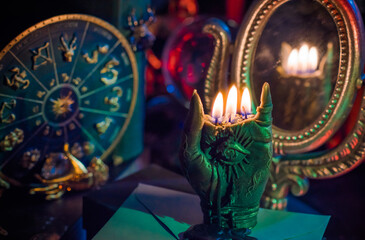 Candle burns on the altar, magic among candles, clean negative energy, wicca concept	