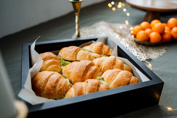 On a beautifully arranged table, there is a black tray that is generously filled to the brim with a...