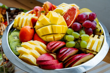 A beautifully arranged table showcases a stunning bowl that is filled to the brim with exquisitely...