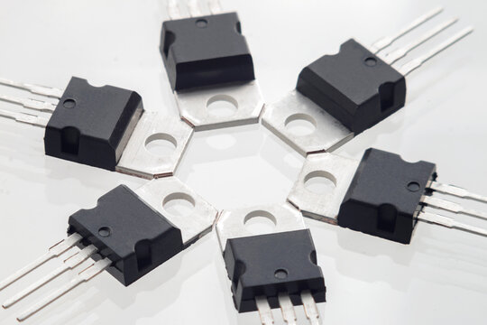 Plastic transistor, model 7812 voltage regulator encapsulated TO220, isolated on white background
