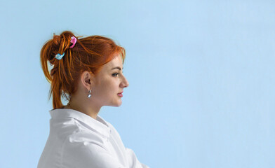 a banner with a portrait of a red-haired female dentist with toothbrushes in her hair