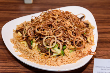 Crispy beef with rice and onions
