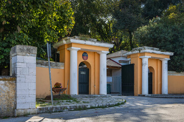 Obraz premium The Gatehouse and the main gate entrance to Mon Repos, birthplace of Prince Philip, Corfu, Greece