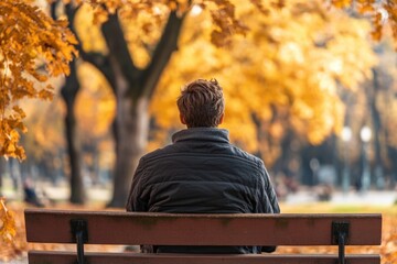 Fototapeta premium A person relaxing on a bench in a park