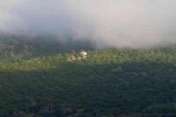 Beautiful view of the mountains with dissipating fog at dawn