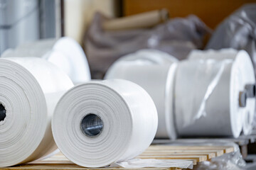 Closeup roll on extruder of polyethylene for process production of plastic bags