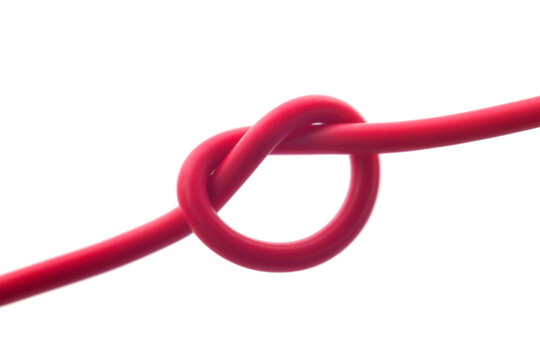 red electrical wire tied in a knot, close up, cut out