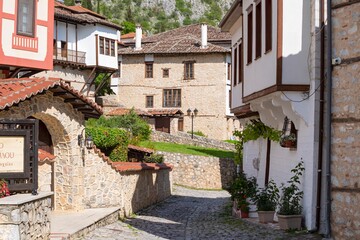 Fototapeta premium Old town of Kastoria in northern Greece in spring. Cityscape. A beautiful street in the old town.