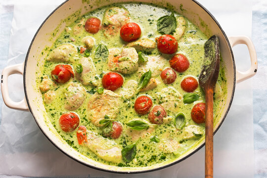 Chicken in creamy basil sauce with cocktail tomatoes 