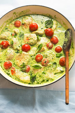 Chicken in creamy basil sauce with cocktail tomatoes 