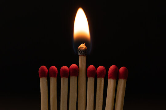 Macro shot of a burning wooden match