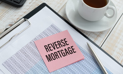 Reverse mortgage form on a table and cup coffee
