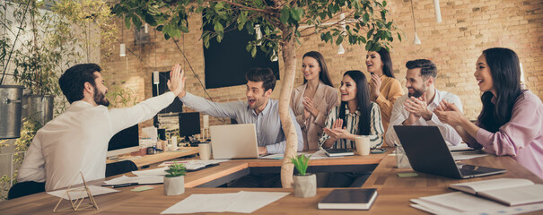 Nice attractive cheerful excited glad confident people entrepreneurs meeting clapping palms...