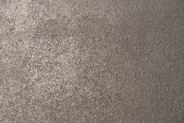 Fototapeta premium wall of black decorative plaster background texture