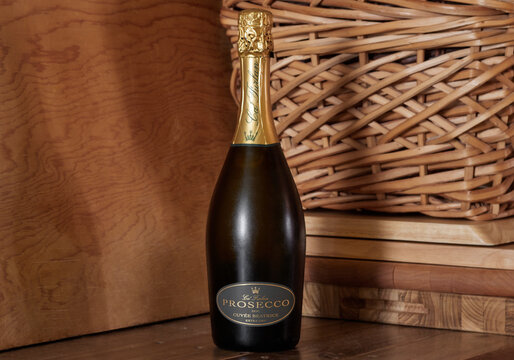 bottle of Ca' Furlan Prosecco, extra dry sparkling white wine, on a rustic bacjground with copy space
