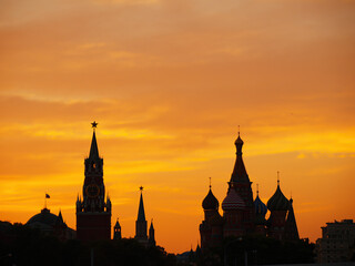 Kremlin at sunset in Moscow, Russia. Dark silhouette of Kremlin and St. Basil's Cathedral in...