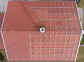 Drone View of Residential Roof with Aluminum Structures Prepared for Solar Panel Installation