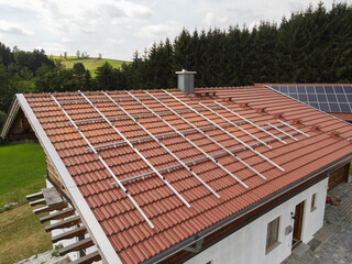 Drone View of Residential Roof with Aluminum Structures Prepared for Solar Panel Installation