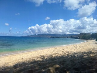beach with puffy white clouds