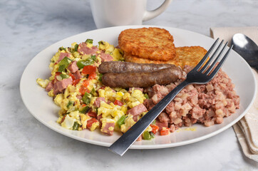 scramble eggs  with  corn beef hash and  sausages