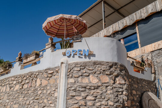 A bar on the beach in Morocco with an open sign
