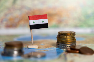 syria flag with coins on a world map, symbolizing syria's economy, finance, trade, economic...
