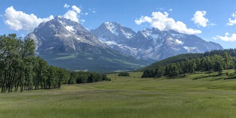 Majestic snow-capped mountains towering over lush green valley. Scenic alpine landscape with meadows, forests, and blue sky. Nature's grandeur for travel, hiking, and outdoor adventure.