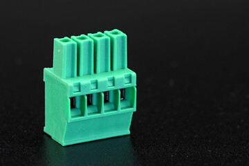 Connector for connecting low-current signals. On a dark background.