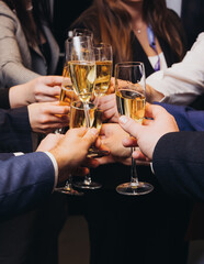 Group of businessmen celebrate, closing successful concluded deal, guests clinking raise glasses...