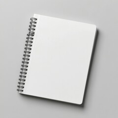 Blank spiral notebook on gray background for writing notes and ideas
