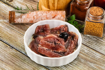 Canned anchovy with oil in the bowl