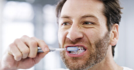Wellness, bathroom and man brushing teeth for dental health, hygiene and morning routine. Oral...