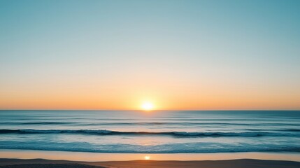 Obraz premium Sunset over tranquil ocean waves on a clear evening by the beach