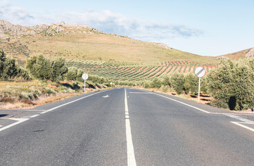 CM-410 paved road with a view to the Peñas Negras castle in Mora (Toledo), province of Toledo, Castilla La Mancha, Spain