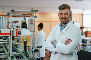 Obraz premium Confident Mid-Adult Male Scientist in Classroom Laboratory