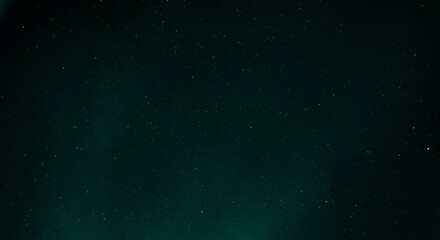 Obraz premium Starry sky with azure nuances of aurora borealis in the sky of Reykjavik, Iceland