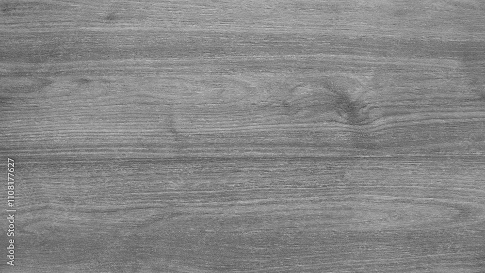 Poster a wooden surface with a grainy texture. the wood is grey and has a natural look. the surface is smoo