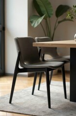 Fototapeta premium modern chair with sleek black frame, paired with section of wooden table. simple and stylish dining room detail, interior design. furniture poster
