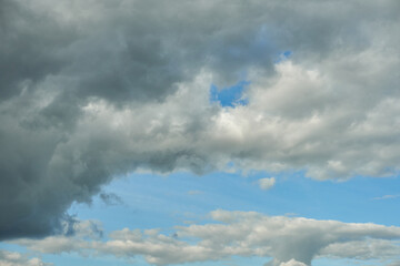 A terrible black cloud hangs in the sky before the rain. Bad weather. Hurricane and thunder over the city. Climate change and natural disasters. Bad mood and despondency.