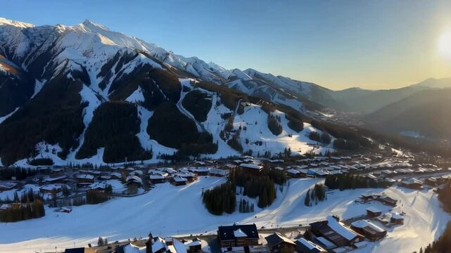 Aerial drone footage captures Vail Village ski resort at sunset, showcasing scenic trails and mountains.