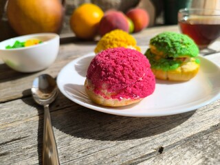 Three iced cakes on a plate. High-quality photos