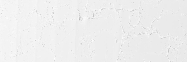 Fototapeta premium Slightly rough and slightly bumpy texture of a white painted wall, stucco, background