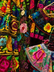 Detailed view of floral and colorful embroidery on traditional Mexican dress